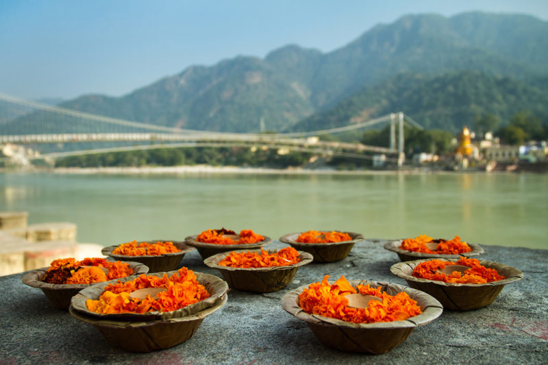 Puja flowers offering at the bank of Ganges river in Rishikesh,